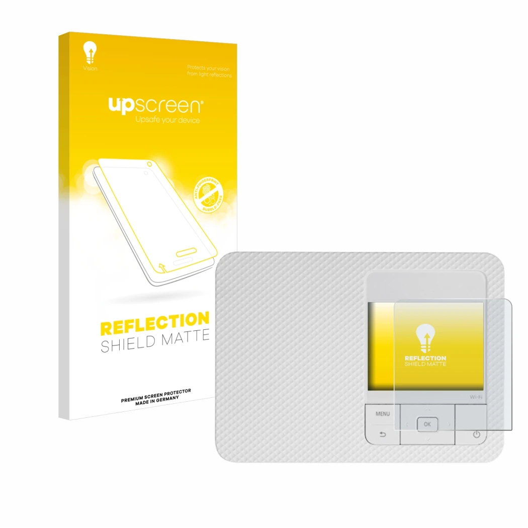 Front side of a product packaging with the brand logo upscreen. Next to it is the device Canon Selphy CP1500 shown with the co
