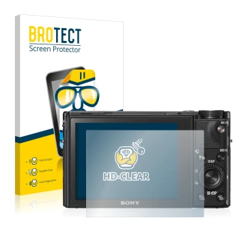 Front side of a product packaging with the brand logo BROTECT. Next to it is the device Sony Cyber-Shot DSC-RX100 VI shown wit