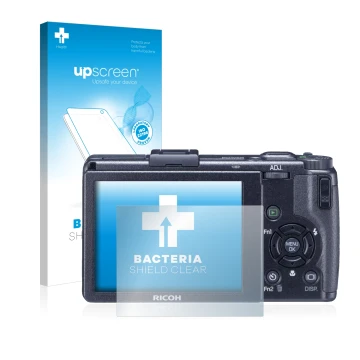 Front side of a product packaging with the brand logo upscreen. Next to it is the device Ricoh GR Digital III (2009-2011) show