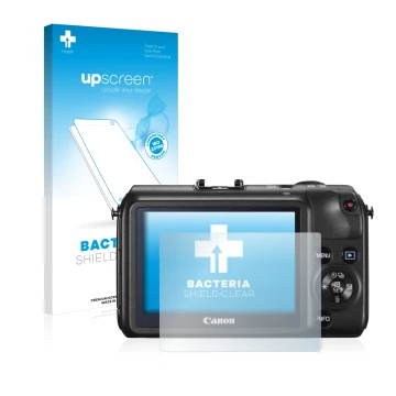 Front side of a product packaging with the brand logo upscreen. Next to it is the device Canon EOS M shown with the correspond