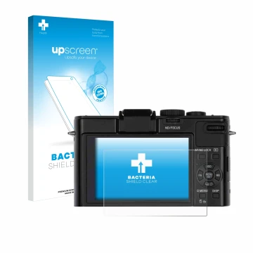 Front side of a product packaging with the brand logo upscreen. Next to it is the device Leica D-Lux 6 shown with the correspo