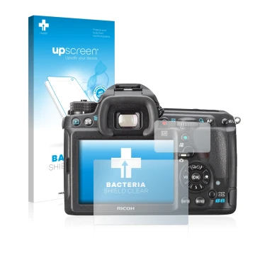 Front side of a product packaging with the brand logo upscreen. Next to it is the device Pentax K3, K-3 shown with the corresp