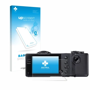 Front side of a product packaging with the brand logo upscreen. Next to it is the device Sigma dp2 Quattro shown with the corr