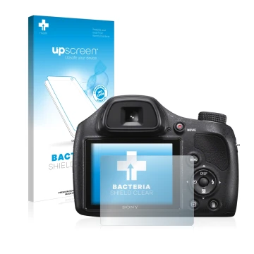 Front side of a product packaging with the brand logo upscreen. Next to it is the device Sony Cyber-Shot DSC-H400 shown with t