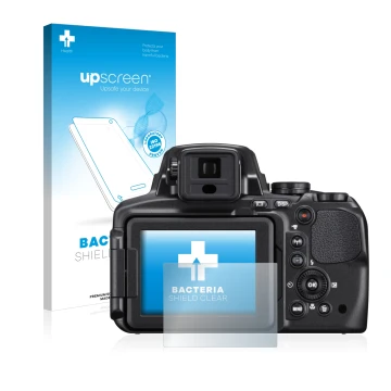 Front side of a product packaging with the brand logo upscreen. Next to it is the device Nikon Coolpix P900 shown with the cor