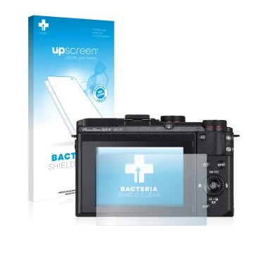 Front side of a product packaging with the brand logo upscreen. Next to it is the device Canon PowerShot G3 X shown with the c