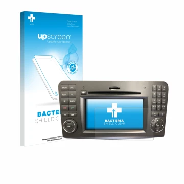 Front side of a product packaging with the brand logo upscreen. Next to it is the device Mercedes-Benz Comand APS 2.5 shown wi