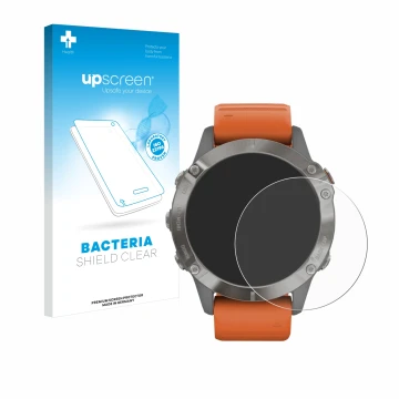 Front side of a product packaging with the brand logo upscreen. Next to it is the device Garmin Fenix 6 Pro Solar shown with t