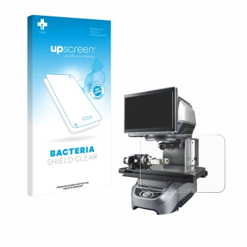 Front side of a product packaging with the brand logo upscreen. Next to it is the device Keyence IM-8030 Glass plate shown wit