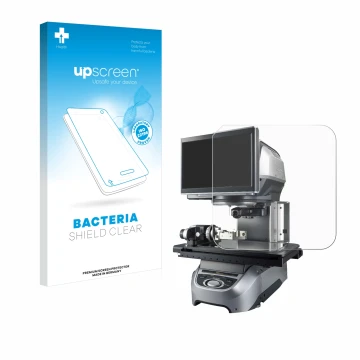 Front side of a product packaging with the brand logo upscreen. Next to it is the device Keyence IM-7020 Glass plate shown wit