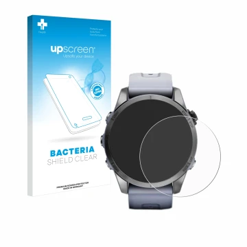 Front side of a product packaging with the brand logo upscreen. Next to it is the device Garmin Fenix 7S (42 mm) shown with th