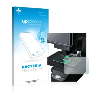 Front side of a product packaging with the brand logo upscreen. Next to it is the device Keyence IM-7030 Glass plate shown wit