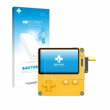 Front side of a product packaging with the brand logo upscreen. Next to it is the device Panic Playdate shown with the corresp