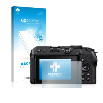 Front side of a product packaging with the brand logo upscreen. Next to it is the device Nikon Z 30 shown with the correspondi