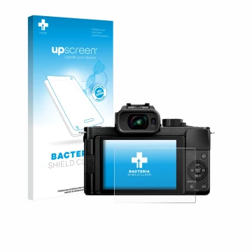 Front side of a product packaging with the brand logo upscreen. Next to it is the device Panasonic Lumix DC-G100D shown with t