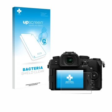 Front side of a product packaging with the brand logo upscreen. Next to it is the device Panasonic Lumix DC-G97 shown with the