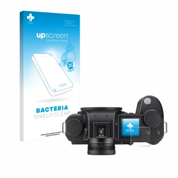 Front side of a product packaging with the brand logo upscreen. Next to it is the device Leica SL3-S (top plate display) shown