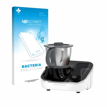 Front side of a product packaging with the brand logo upscreen. Next to it is the device TOKIT Omni Cook C2 shown with the cor