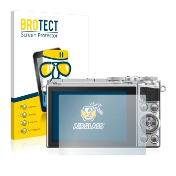 Front side of a product packaging with the brand logo BROTECT. Next to it is the device Nikon 1 J5 shown with the correspondin
