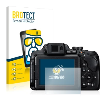 Front side of a product packaging with the brand logo BROTECT. Next to it is the device Nikon Coolpix B700 shown with the corr