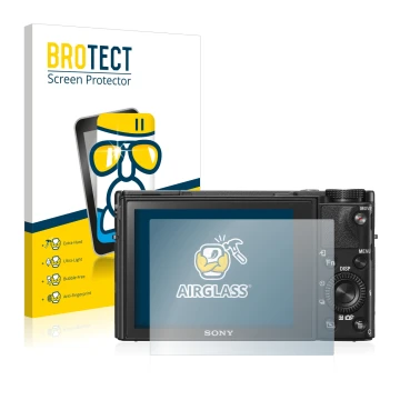 Front side of a product packaging with the brand logo BROTECT. Next to it is the device Sony Cyber-Shot DSC-RX100 V shown with