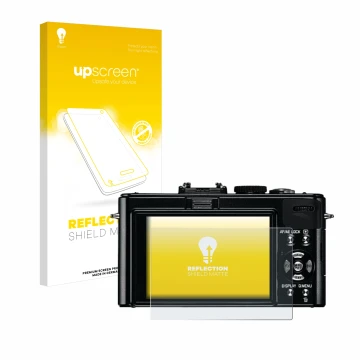 Front side of a product packaging with the brand logo upscreen. Next to it is the device Leica D-Lux 5 shown with the correspo