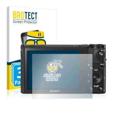 Front side of a product packaging with the brand logo BROTECT. Next to it is the device Sony Cyber-Shot DSC-RX100 V shown with