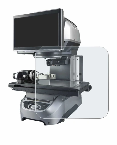 Image of the device Keyence IM-8020 Glass plate with a wide variety of screen protectors.