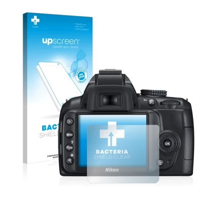 Front side of a product packaging with the brand logo upscreen. Next to it is the device Nikon D3000 shown with the correspond