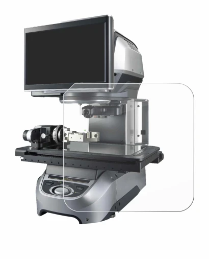 Image of the device Keyence IM-8020 Glass plate with a wide variety of screen protectors.