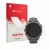 Front side of a product packaging with the brand logo upscreen. Next to it is the device Garmin Fenix 9 (47 mm) shown with the