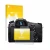 Front side of a product packaging with the brand logo upscreen. Next to it is the device Sony Cyber-Shot DSC-RX10 IV shown wit